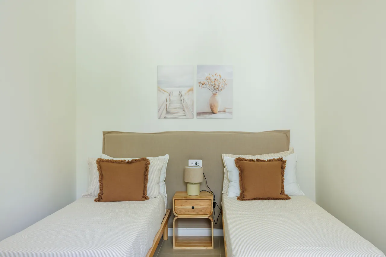 the bedroom with two separate beds
