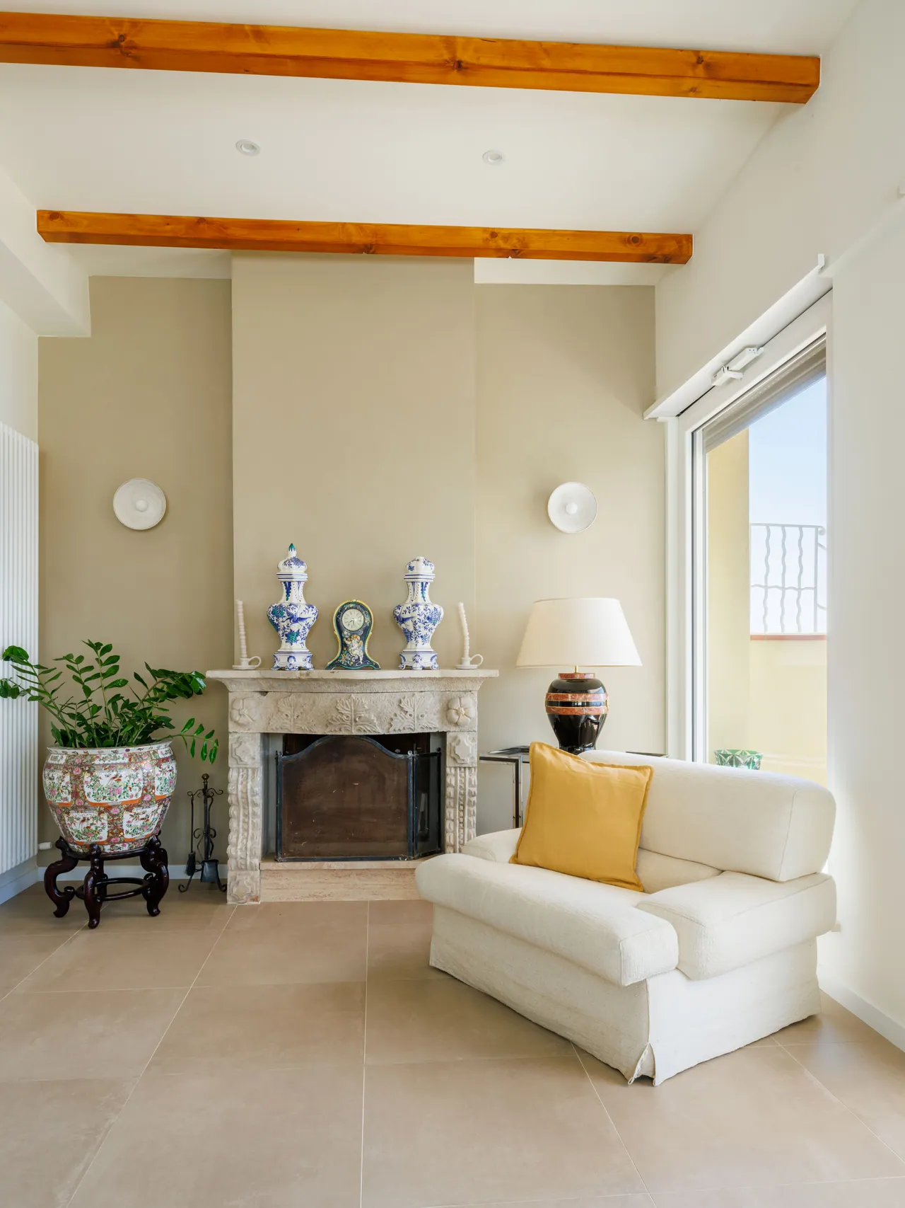 the living room at Casa Awaya, with pale sofas and the fireplace