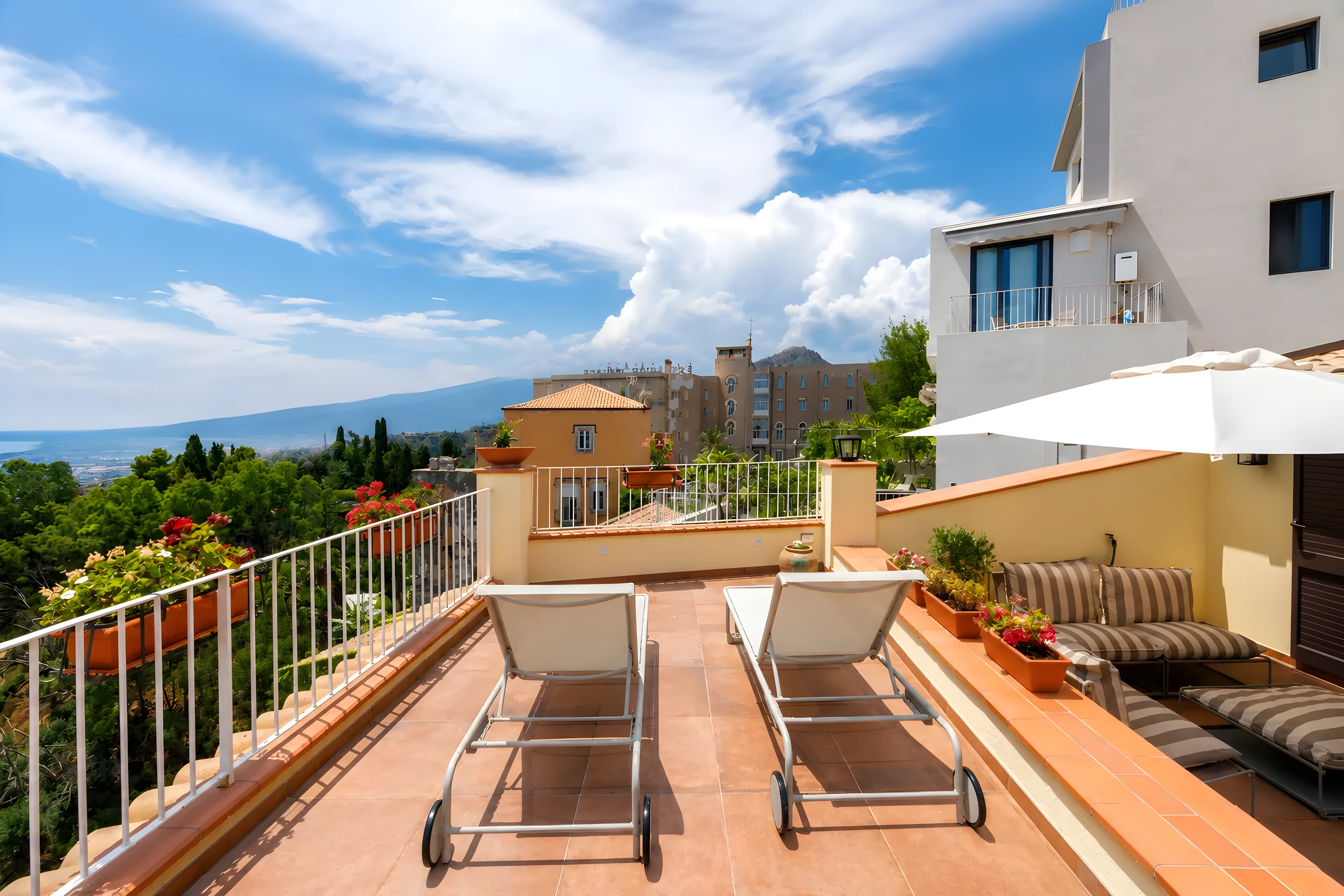 La terrazza alta di Casa Awaya con lettini in cotto e panorama aperto su Taormina